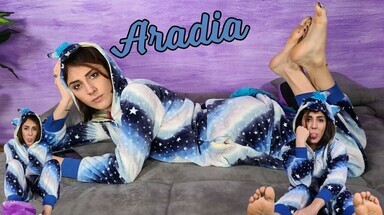  Stunning Aradia in a one-piece hooded pajama and purple slippers